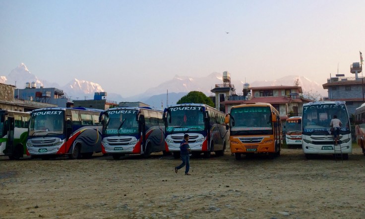 Mountain peaks behind the bus park